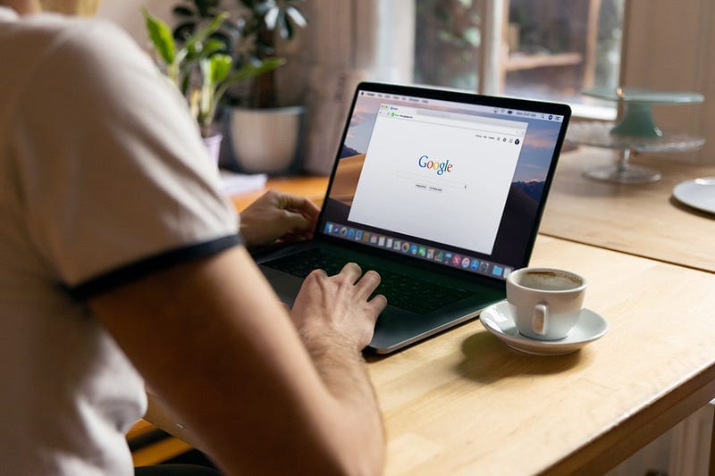 student using a laptop with google